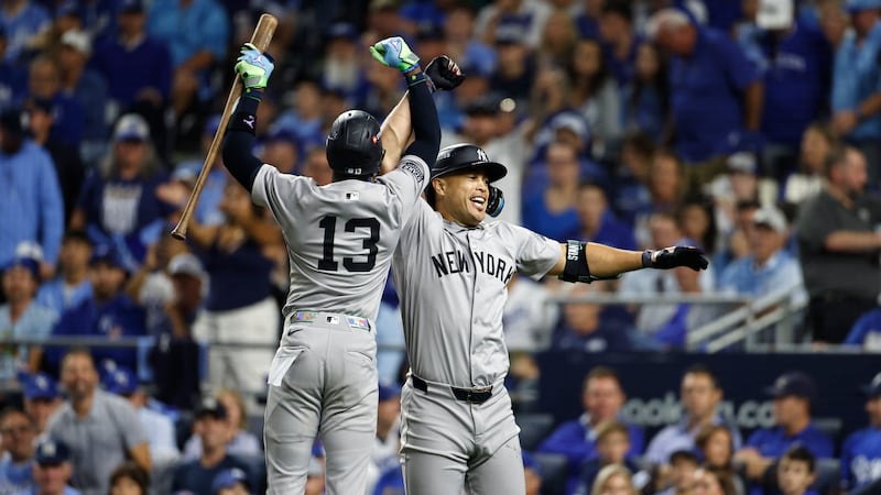 New York Yankees' Giancarlo Stanton is congratulated by teammate Jazz Chisholm Jr. (13) after...